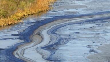 Flooding results in river oil leak
