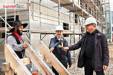 Infratec host topping-out ceremony for new building complex shell for future cleanroom and office areas