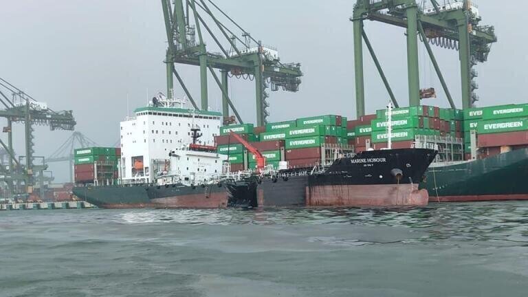 Singapore rushes to deal with oil spill after dredger collision
